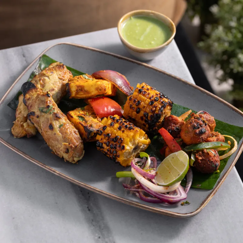 Padharo Royal Grill Platter — Our showpiece tandoor platter - char-grilled malai chaap, paneer tikka and more, vegetarian Indian dish at Padharo Southampton