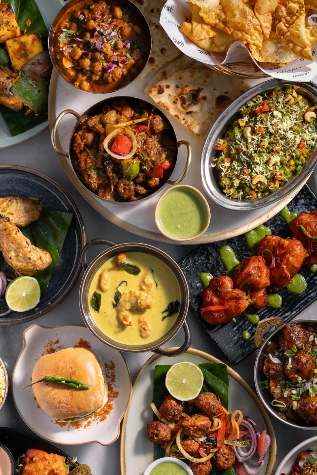 An overhead spread of Padharo's vegetarian Indian dishes: curries, chaats, street food and tandoori-style plates